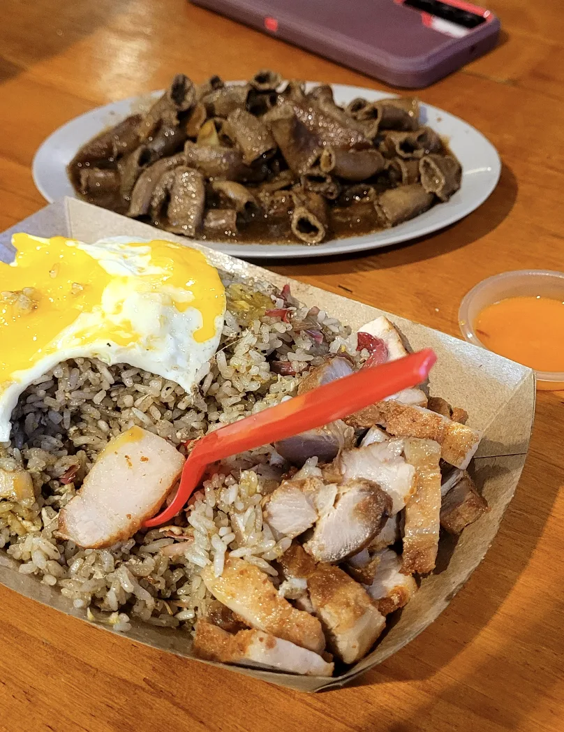 Pork rice with a runny egg and a side of offal