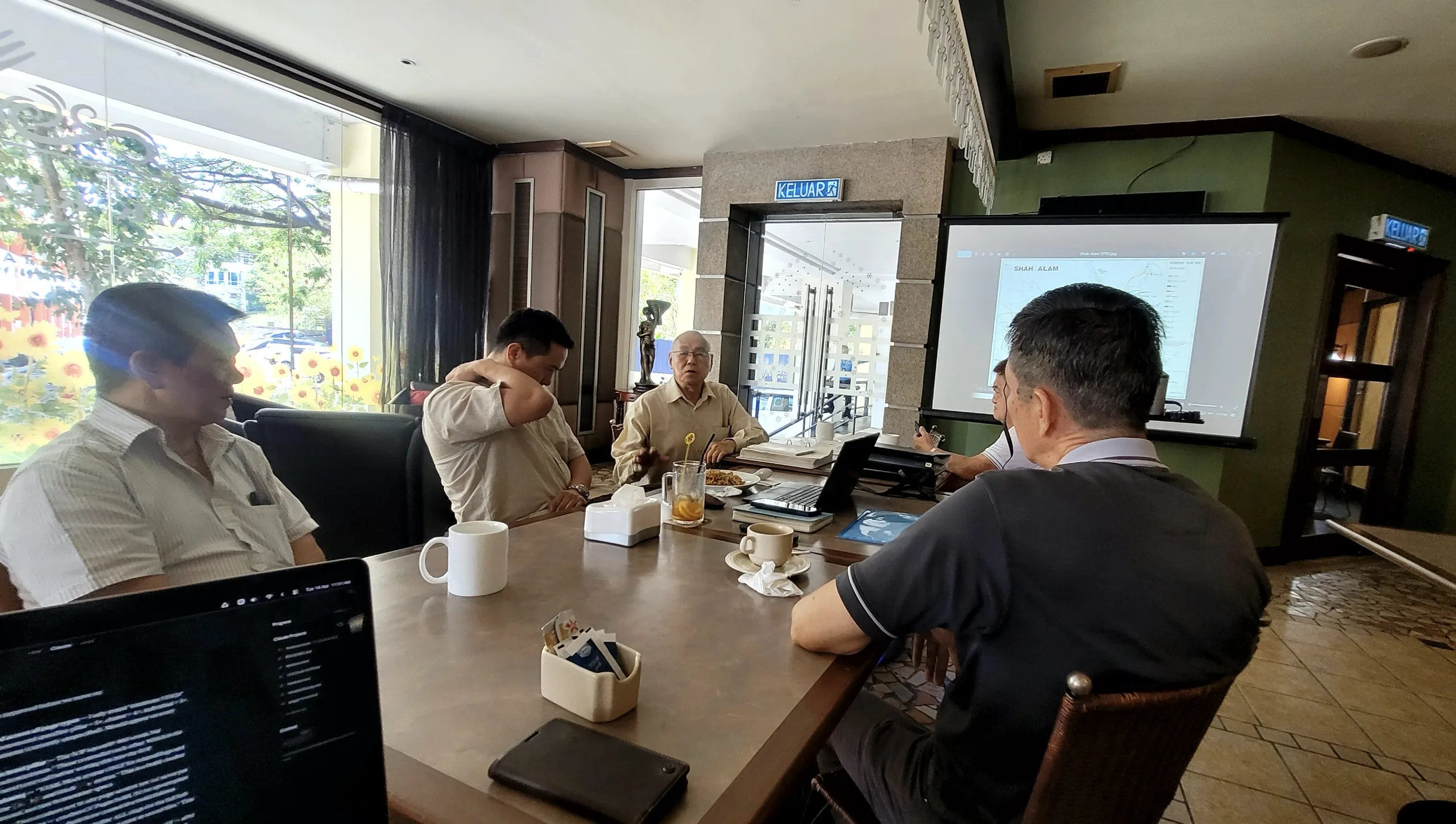 Monthly meeting at the café with the mentor and team