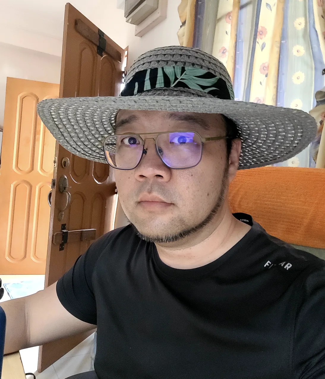 Daniel in mum's straw garden hat