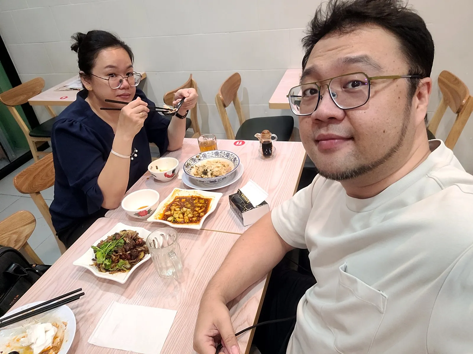 Dinner for two with several dishes on the table