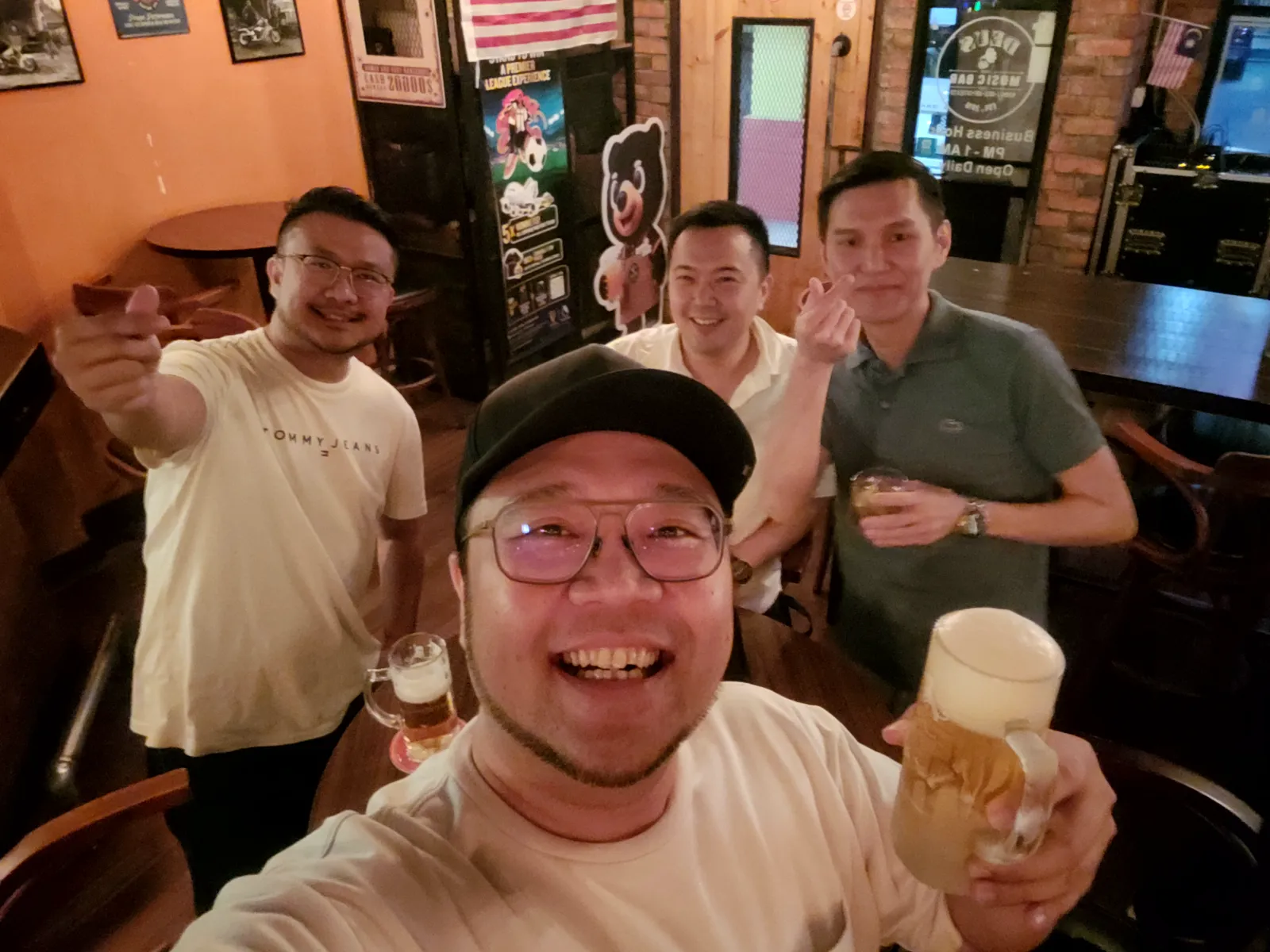 Group selfie with friends at a bar