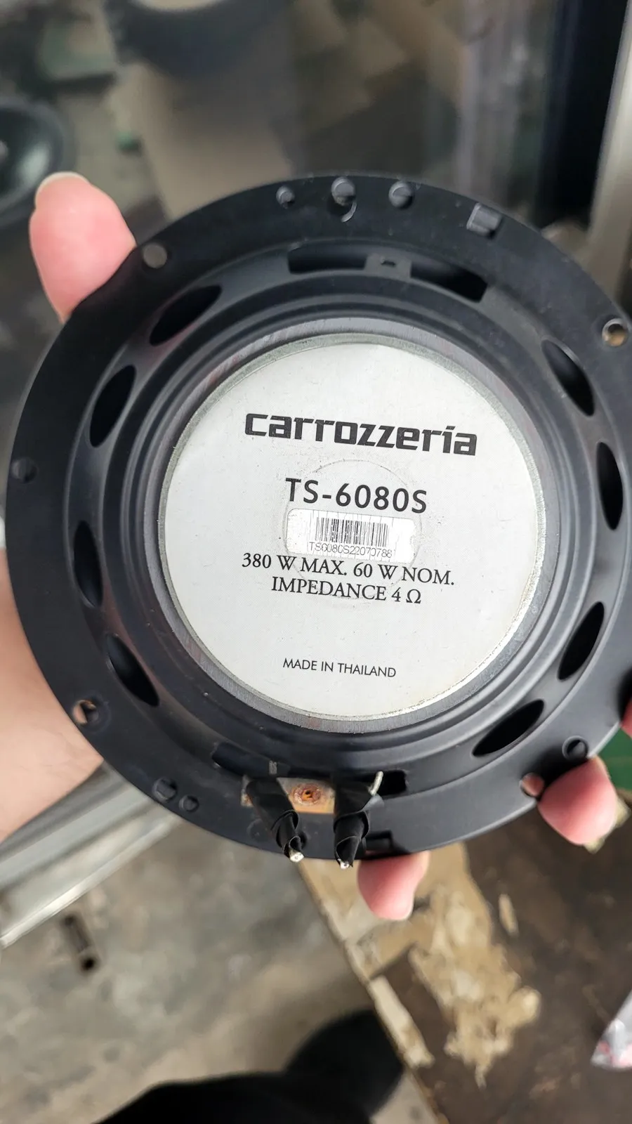 A new speaker held up in the workshop